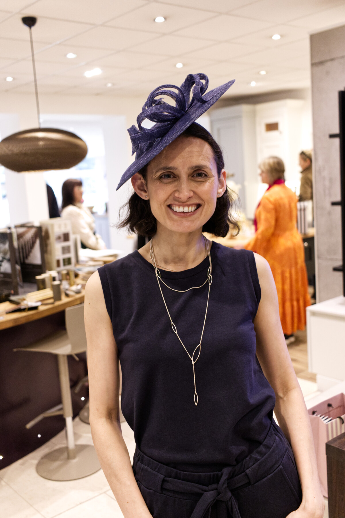 Maria wearing WearTwo, necklace and hat